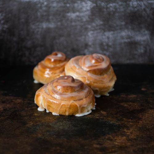 Freshly baked iced cinnamon scrolls from Suprima's wholesale cafe dough range