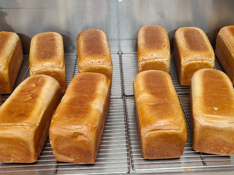 Trays of freshly baked loaves at FoodWorks Pottsville, baked in-store from Suprima dough